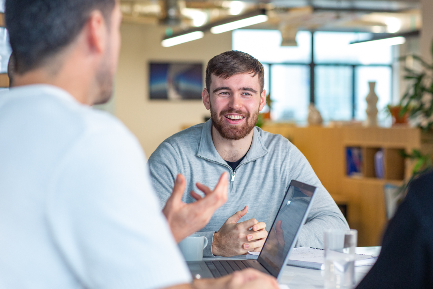 a team discussing if tech companies should be profitable