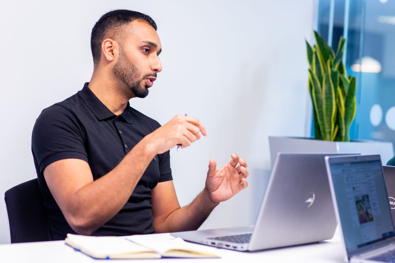 change and transformation recruitment worker sitting at desk gesturing